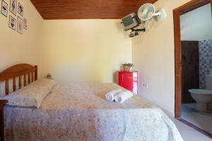 Cama ou camas em um quarto em Pousada Aconchego