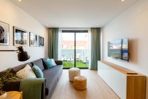 Televízia a/alebo spoločenská miestnosť v ubytovaní Luxury Penthouse With Jacuzzi La Strada