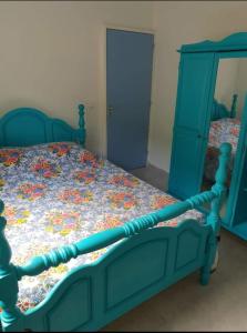 En eller flere senge i et værelse på Villa REMY