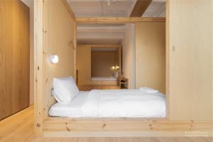 Voodi või voodid majutusasutuse 山鄰山林青年文旅 forest 3030 hostel toas