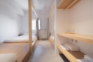 Voodi või voodid majutusasutuse 山鄰山林青年文旅 forest 3030 hostel toas