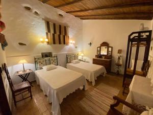 Katil atau katil-katil dalam bilik di Monte Abaixo