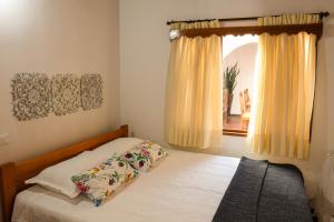 Ένα ή περισσότερα κρεβάτια σε δωμάτιο στο La Casa de Ana