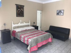 Un pat sau paturi într-o cameră la Linda Casa Acogedora