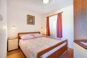 Postel nebo postele na pokoji v ubytování House Marta