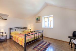Postel nebo postele na pokoji v ubytování House Marta