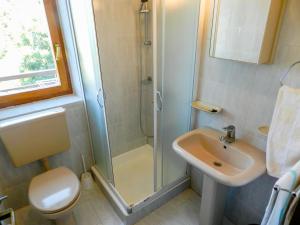 a small bathroom with a shower and a sink at Apartments Josip in Rabac +52 photos