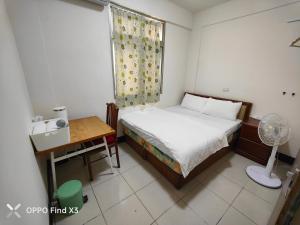Ένα ή περισσότερα κρεβάτια σε δωμάτιο στο Homestyle Homestay