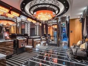 a lobby of a hotel with a chandelier at APA Hotel Akihabara Ekihigashi in Tokyo