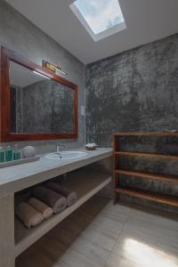 a bathroom with a sink and a mirror at Green Escape Unawatuna in Unawatuna