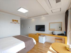 A television and/or entertainment center at Jeju Lavender Hotel