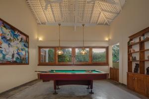 a living room with a pool table in it at Green Escape Unawatuna in Unawatuna