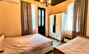 Postel nebo postele na pokoji v ubytování Mango's Guesthouse