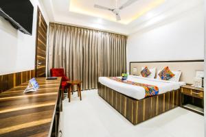 Postel nebo postele na pokoji v ubytování FabHotel Prime Sapphire Inn