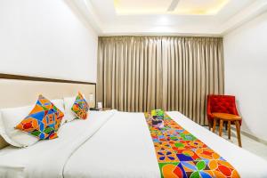 Postel nebo postele na pokoji v ubytování FabHotel Prime Sapphire Inn
