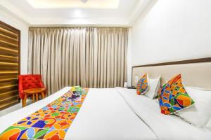 Postel nebo postele na pokoji v ubytování FabHotel Prime Sapphire Inn