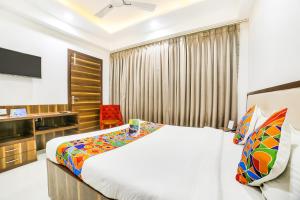 Postel nebo postele na pokoji v ubytování FabHotel Prime Sapphire Inn