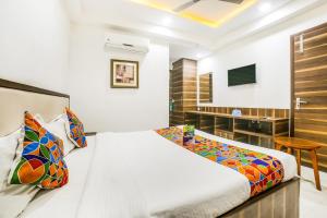 Postel nebo postele na pokoji v ubytování FabHotel Prime Sapphire Inn