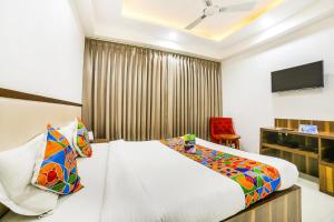 Postel nebo postele na pokoji v ubytování FabHotel Prime Sapphire Inn
