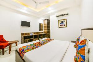 Postel nebo postele na pokoji v ubytování FabHotel Prime Sapphire Inn