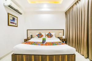 Postel nebo postele na pokoji v ubytování FabHotel Prime Sapphire Inn