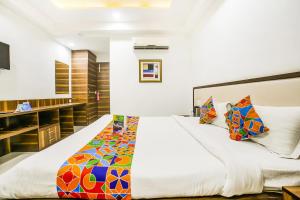 Postel nebo postele na pokoji v ubytování FabHotel Prime Sapphire Inn