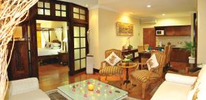 a living room with a couch and a table at The Jayakarta Bali Beach Resort in Legian