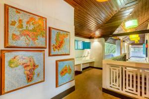 a room with maps on the wall at goSTOPS Alleppey in Alleppey