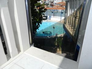 a view of a swimming pool from a balcony at Villa Elit in Dugi Rat