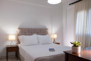 A bed or beds in a room at Aegean Blue Horizon