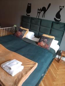 Posteľ alebo postele v izbe v ubytovaní Apartament Koci Łeb