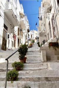 a group of stairs in a city with plants at Dimora Le Volte Ostuni in Ostuni +31 photos