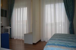 Postel nebo postele na pokoji v ubytování Park Hotel Perù ***S