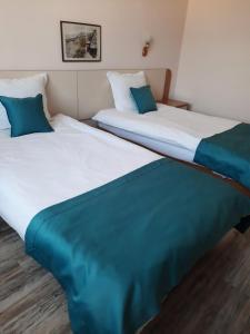 Ein Bett oder Betten in einem Zimmer der Unterkunft Hotel Balkan