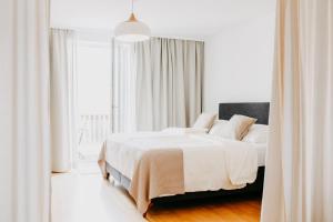 A bed or beds in a room at Landgut Riegerbauer