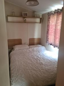 a bedroom with a bed in a small room at The orchards holiday home in Clacton-on-Sea