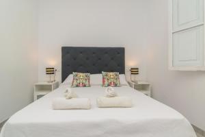 En eller flere senge i et værelse på Villa Maria 6