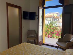 TV a/nebo společenská místnost v ubytování Hostal Loreto
