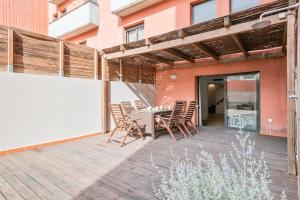 a patio with a table and chairs on it at Inside Barcelona Apartments Princep in Barcelona
