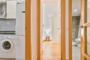 a laundry room with a washer and dryer at Inside Barcelona Apartments Princep in Barcelona +37 photos