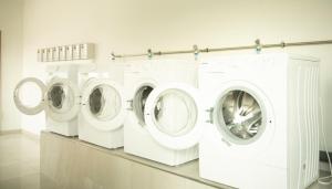 a row of washing machines in a laundry room at Stadthotel Donauwörth in Donauwörth +97 photos