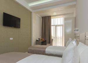 Dave Hotel Yerevan客房内的一张或多张床位