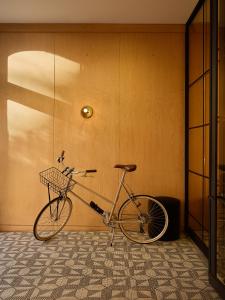 a bike parked in front of a door in a room at The Moore in New York