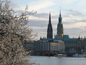 a view of a city with a river and buildings at Pension am Rathaus in Hamburg