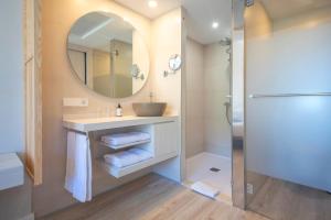 a bathroom with a sink and a mirror at Blau Colònia Sant Jordi in Colònia de Sant Jordi