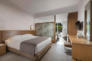 Postel nebo postele na pokoji v ubytování Platanista Hotel