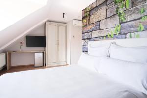 Voodi või voodid majutusasutuse The Kepos Hotel Erlangen toas