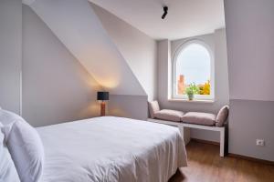 Voodi või voodid majutusasutuse The Kepos Hotel Erlangen toas