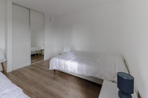 Postel nebo postele na pokoji v ubytování Ombeline