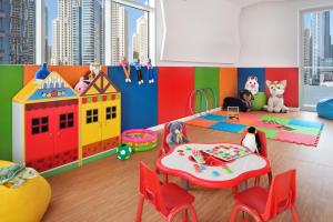 a small child's play room with toys on the floor at Crowne Plaza Dubai Marina, an IHG Hotel in Dubai